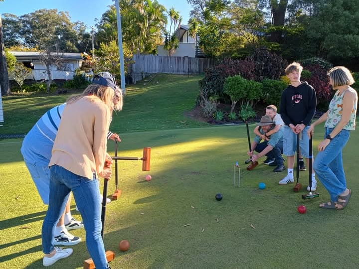 Three generations celebrate 80th birthday with croquet